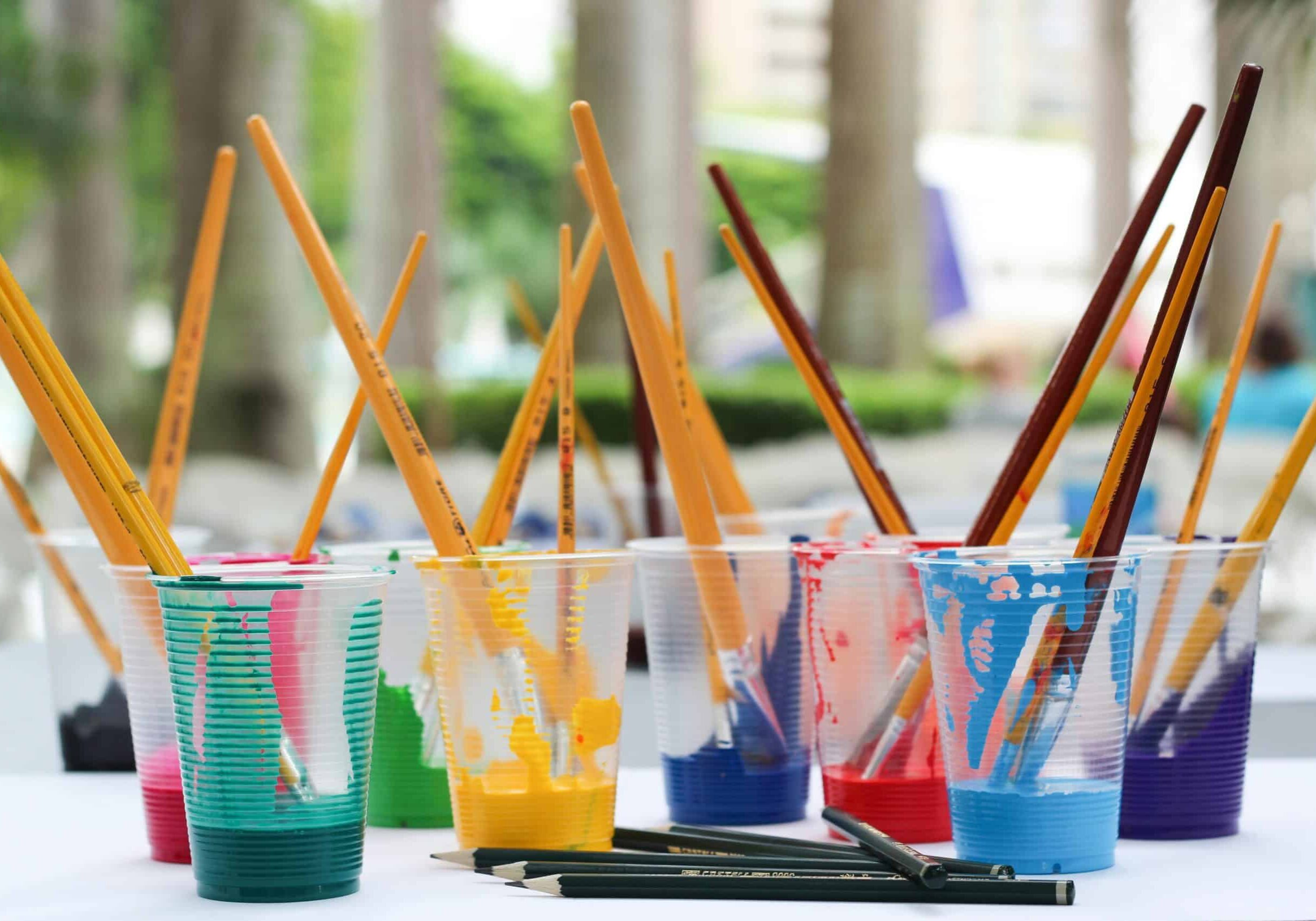paintbrushes-in-cups-with-paint