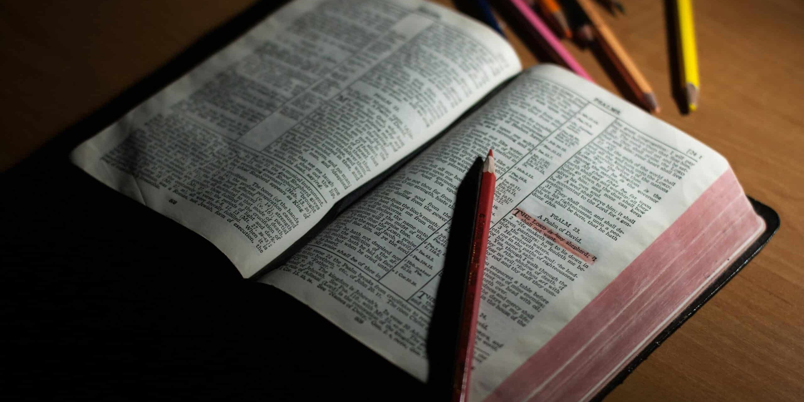 pencil-on-bible-on-table